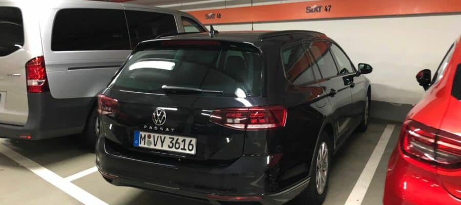 A VW Passat from Sixt is parking in a lot