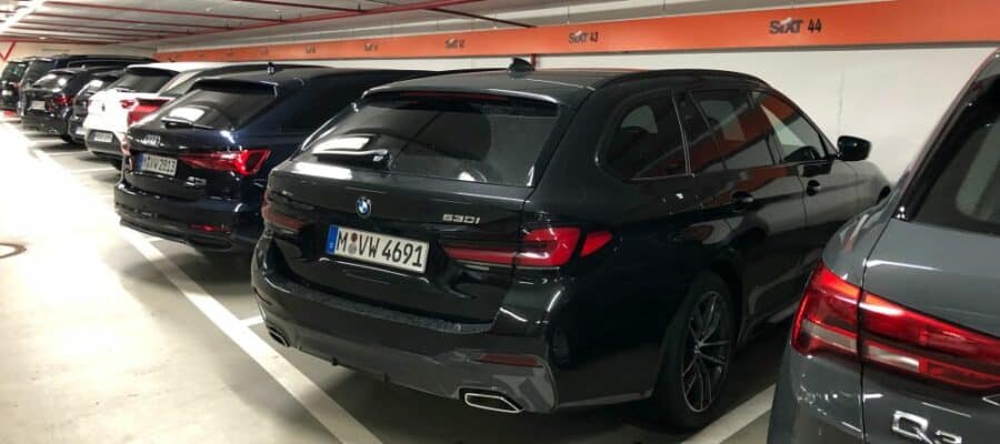 A Sixt BMW530i in XCAR category parking in a lot